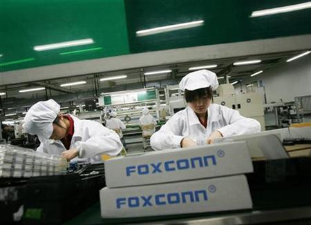 Employees work inside a Foxconn factory in the township of Longhua in the southern Guangdong province in this May 26, 2010 file photo
